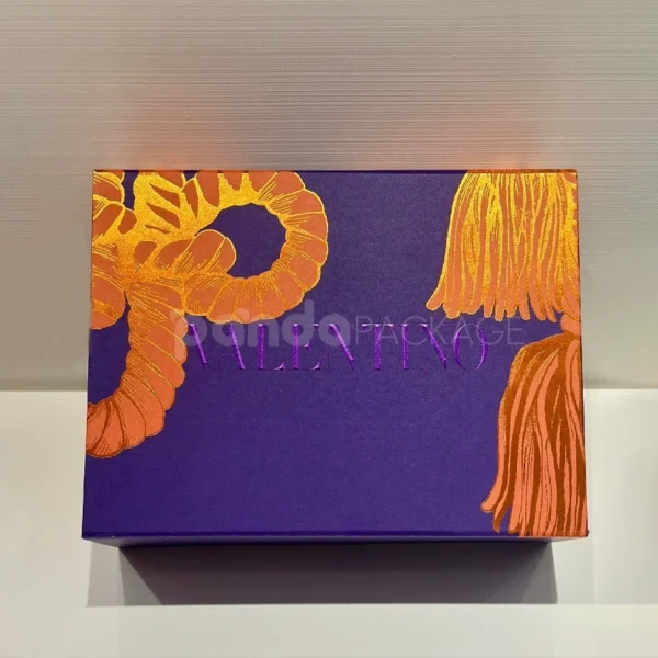 Bold Purple Gift Box with Orange Rope Tassel Accents