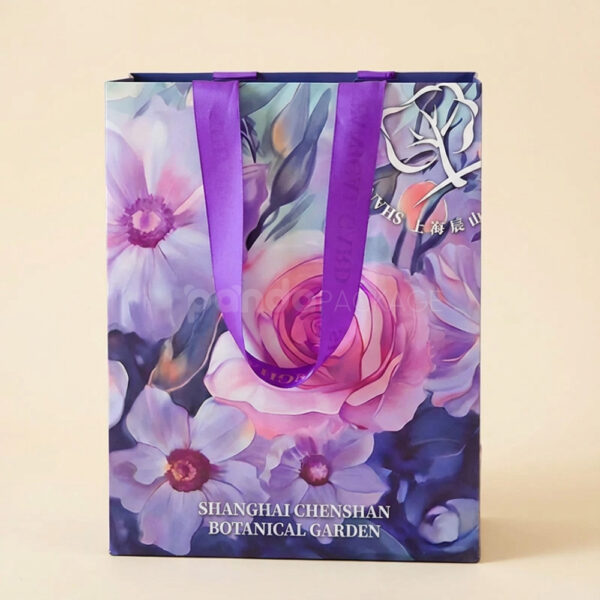 Floral Gift Bag with Purple Ribbon Handles