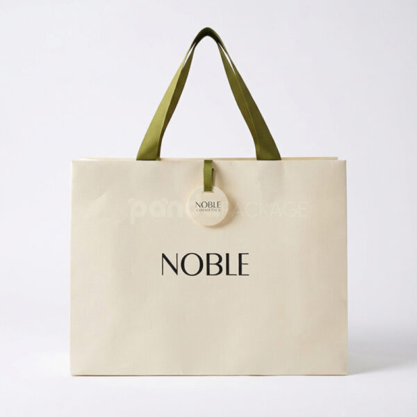 Elegant White Gift Bag with Green Ribbon Handles