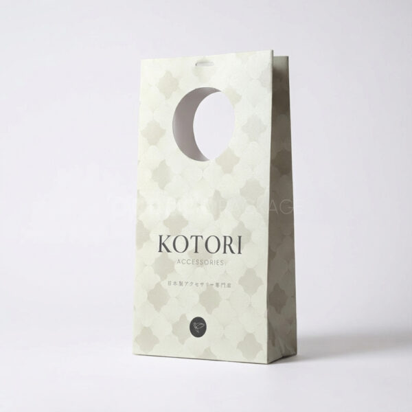 Elegant White Gift Bag with Circular Cutout Handle