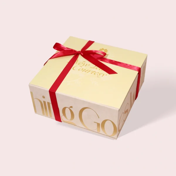 Elegant Cream & Gold Gift Box with Red Ribbon