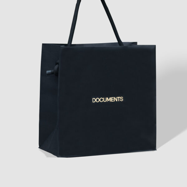 Minimalist Black Paper Bag with Gold Foil Logo