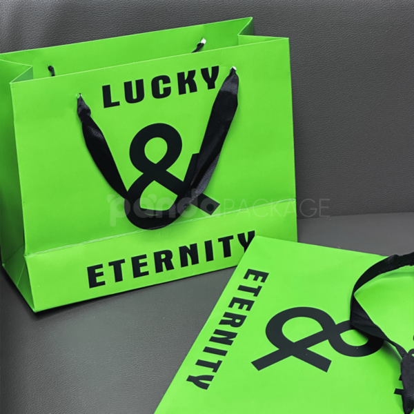 Vibrant Green Gift Bag with Bold Typography