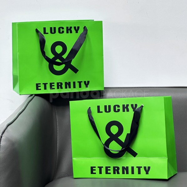 Vibrant Green Gift Bag with Bold Typography