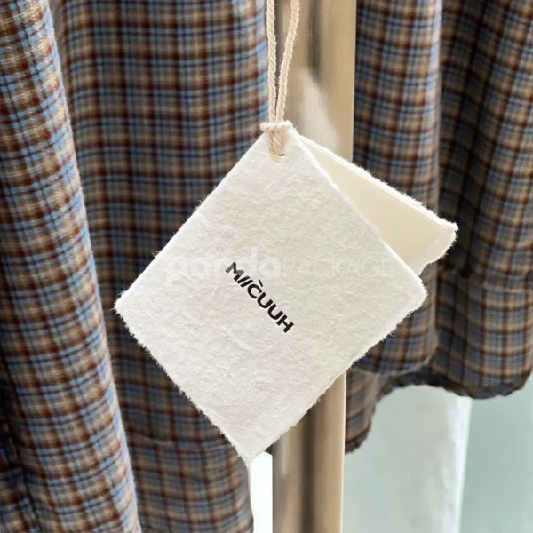 Minimalist Textured Garment Hang Tag with Embossed Logo
