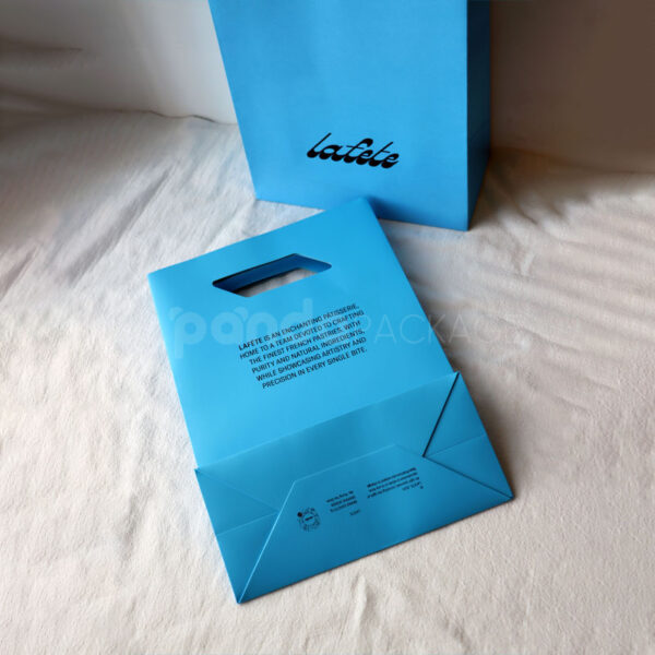 Bold Blue and White Retail Packaging Set with Die-Cut Handle Bag - second image
