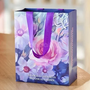 Floral Gift Bag with Purple Ribbon Handles