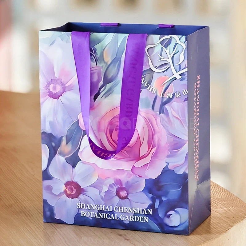 Floral Gift Bag with Purple Ribbon Handles