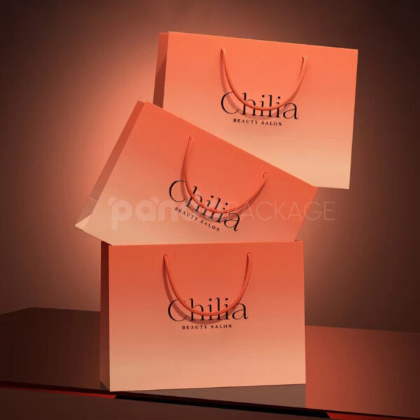 Coral Pink Gift Bag with Gold Rope Handles