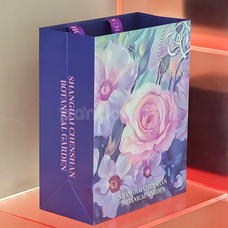 Floral Gift Bag with Purple Ribbon Handles