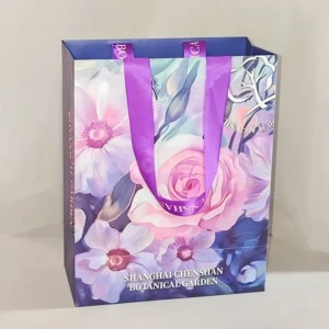 Floral Gift Bag with Purple Ribbon Handles