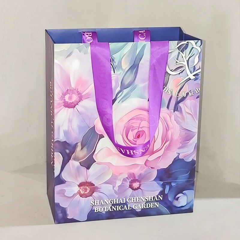 Floral Gift Bag with Purple Ribbon Handles