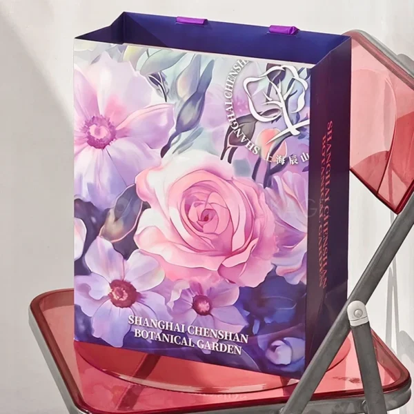 Floral Gift Bag with Purple Ribbon Handles