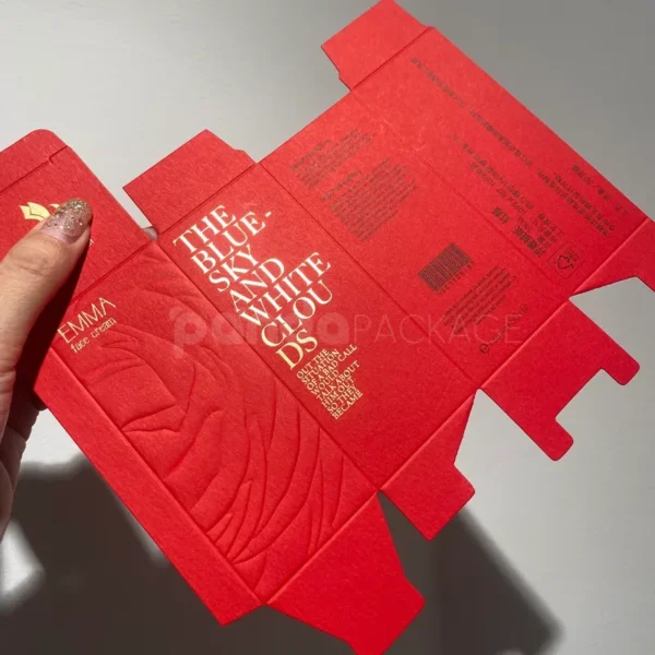 Red Embossed Paper Box with Gold Foil Typography