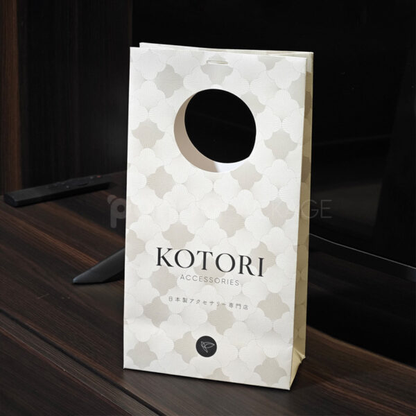 Elegant White Gift Bag with Circular Cutout Handle
