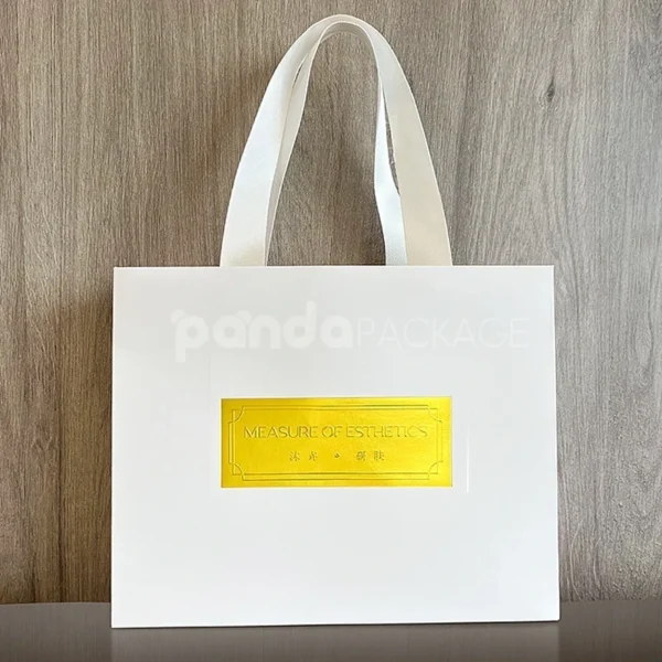 Minimalist White Gift Bag with Gold Foil Logo