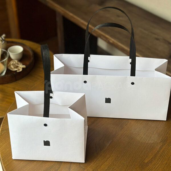 Elegant White Gift Bag with Square Logo Detail
