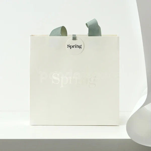 Embossed White Gift Bag with Sage Green Ribbon