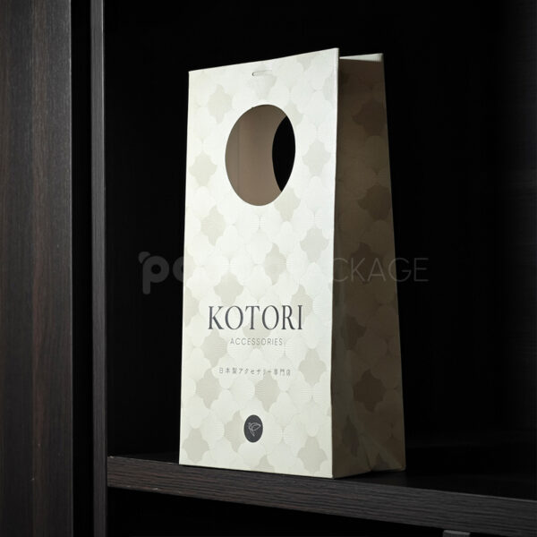 Elegant White Gift Bag with Circular Cutout Handle
