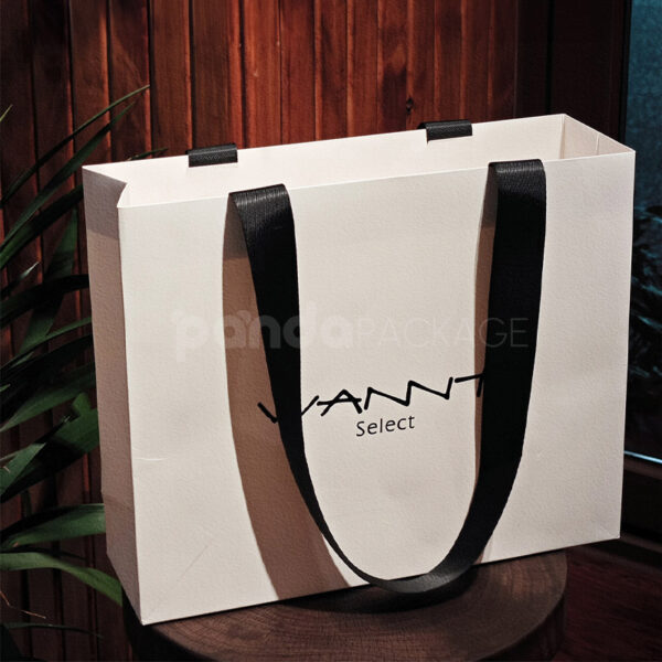 Monochrome Tote-Style Paper Bag with Oversized Black Ribbon Handles