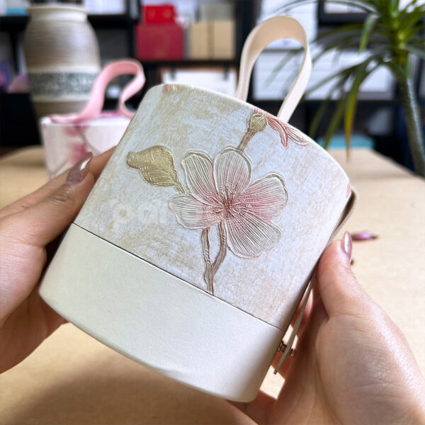 Ivory Pink Round Handheld Gift Box with Scodix Digital Enhancement and Faux Leather Handle