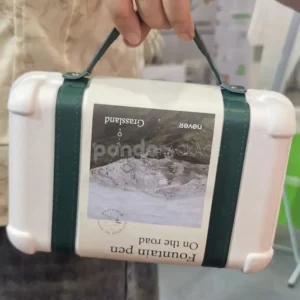 Elegant white gift box with luxurious green leather handle for gifting