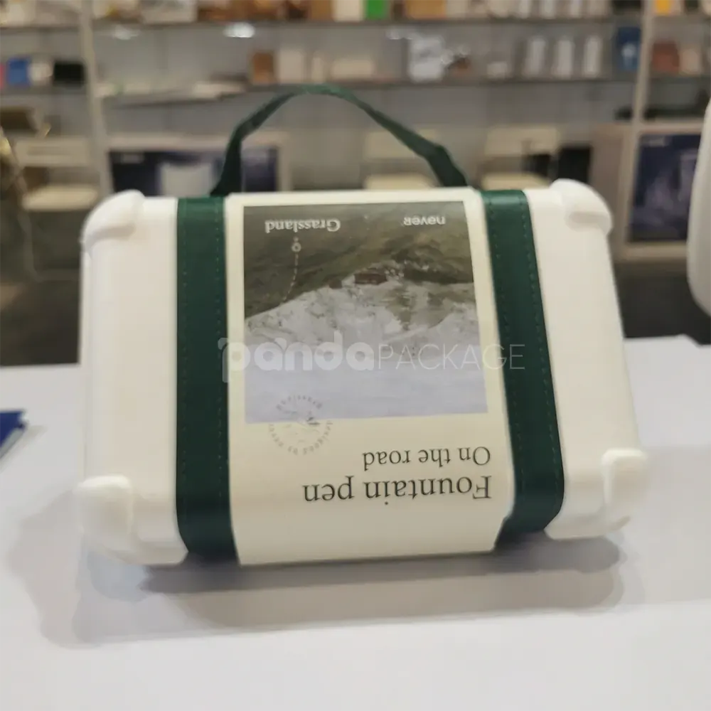 Elegant white gift box with luxurious green leather handle for gifting