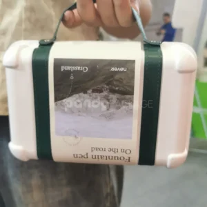 Elegant white gift box with luxurious green leather handle for gifting