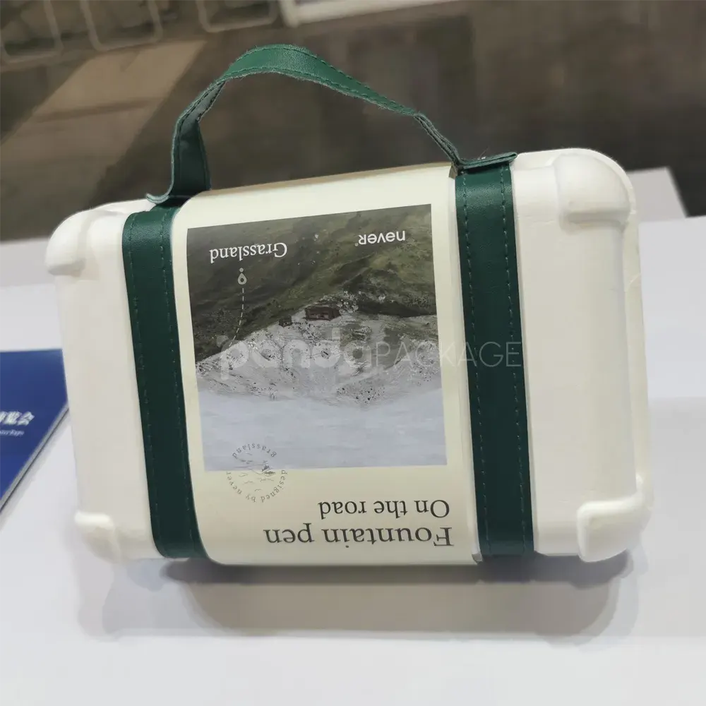 Elegant white gift box with luxurious green leather handle for gifting