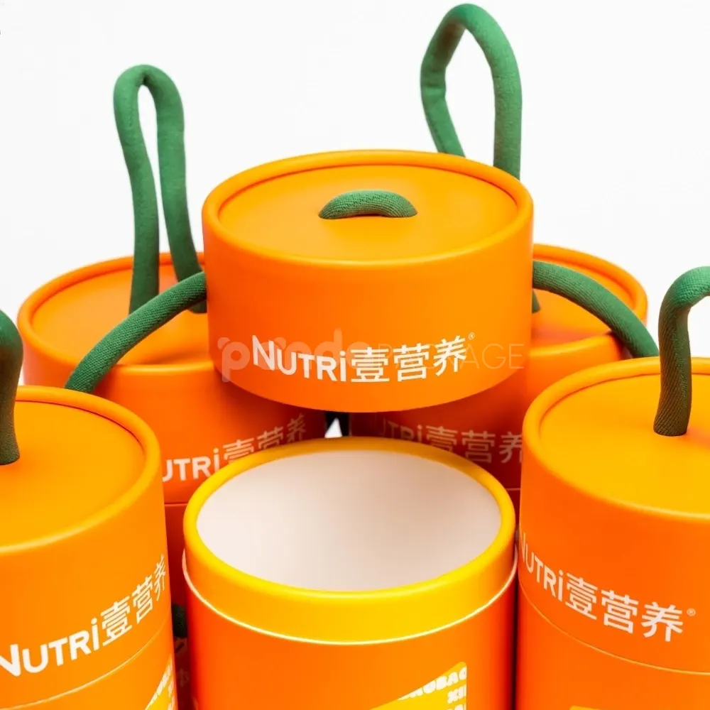 Bright orange paper cylinder with green rope handle for safe food packaging and portable presentation