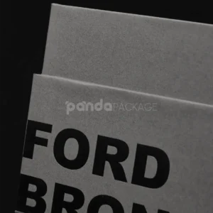 Luxury grey rigid box with lift-off lid and black foil stamped logo