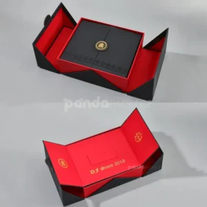 Black double door rigid gift box with gold foil medallion and red interior