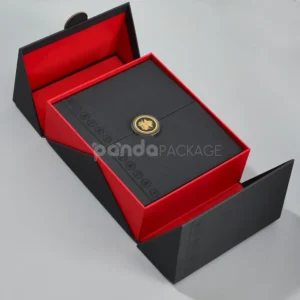Black double door rigid gift box with gold foil medallion and red interior