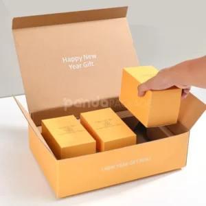 foldable kraft mailer box with divider insert and handle in orange print