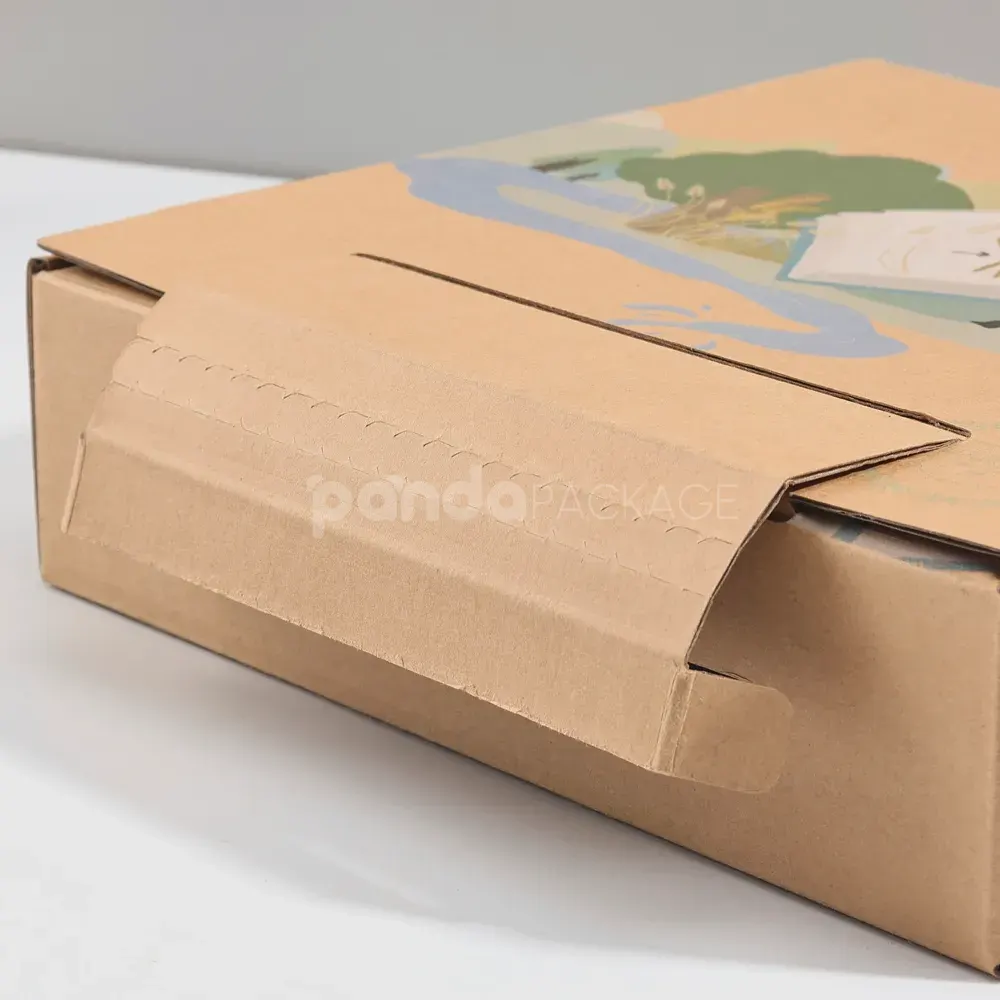 Foldable printed mailer box with tear strip for unboxing