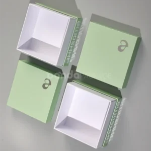 pastel matcha green rigid box with lift-off lid and foil logo