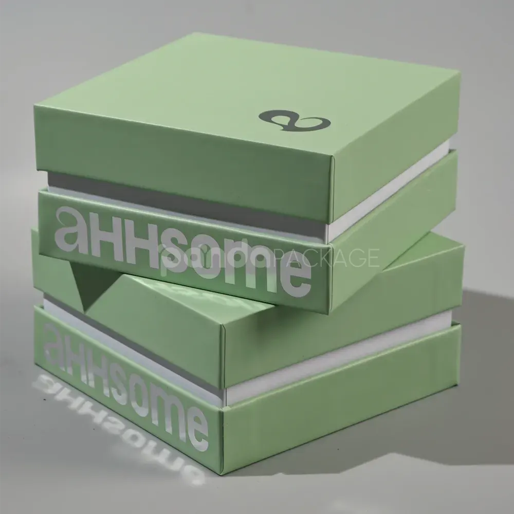 pastel matcha green rigid box with lift-off lid and foil logo