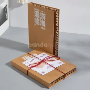 kraft book-style rigid box with flip lid and red tie cord