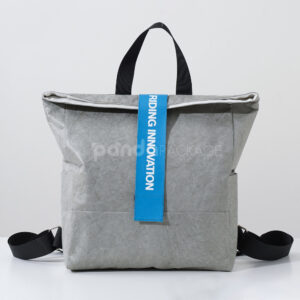 Gray Tyvek paper backpack with bold blue strap
