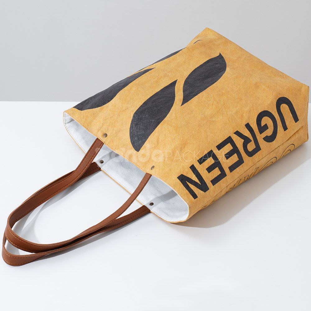 Eco kraft paper tote bag with leather handles and logo print