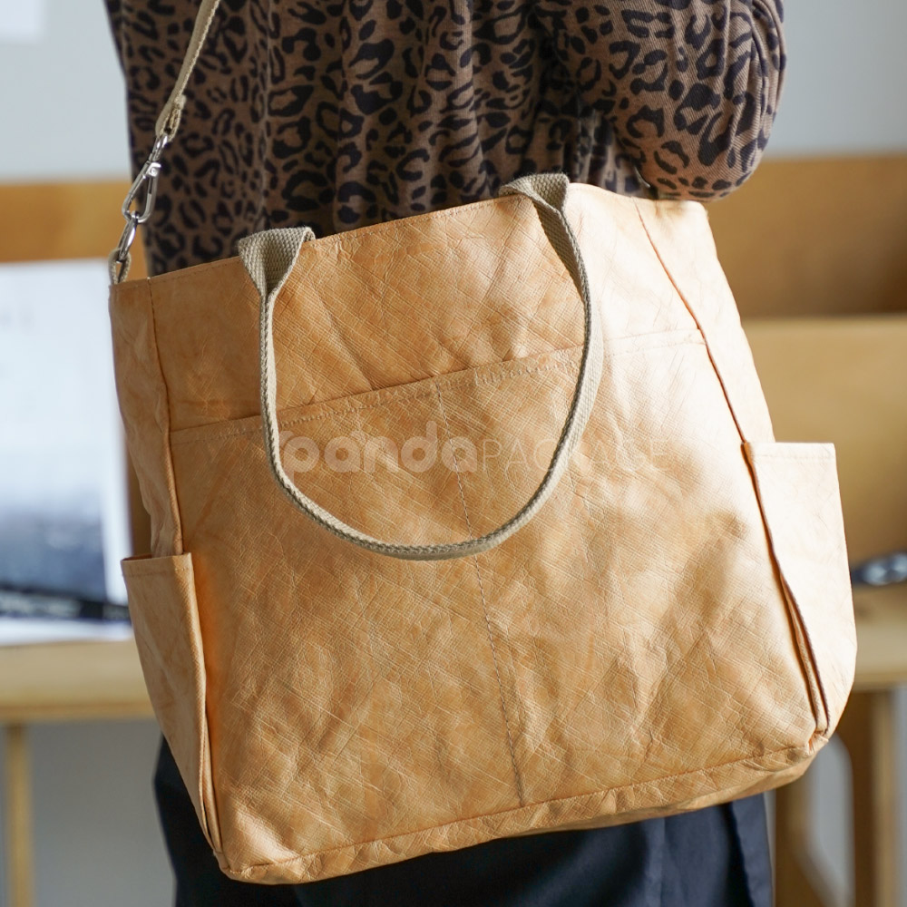 kraft paper tote bag with shoulder strap and side pockets