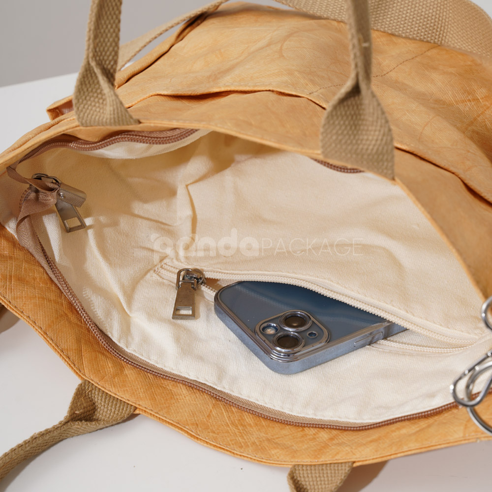 kraft paper tote bag with shoulder strap and side pockets