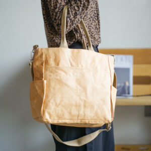 kraft paper tote bag with shoulder strap and side pockets