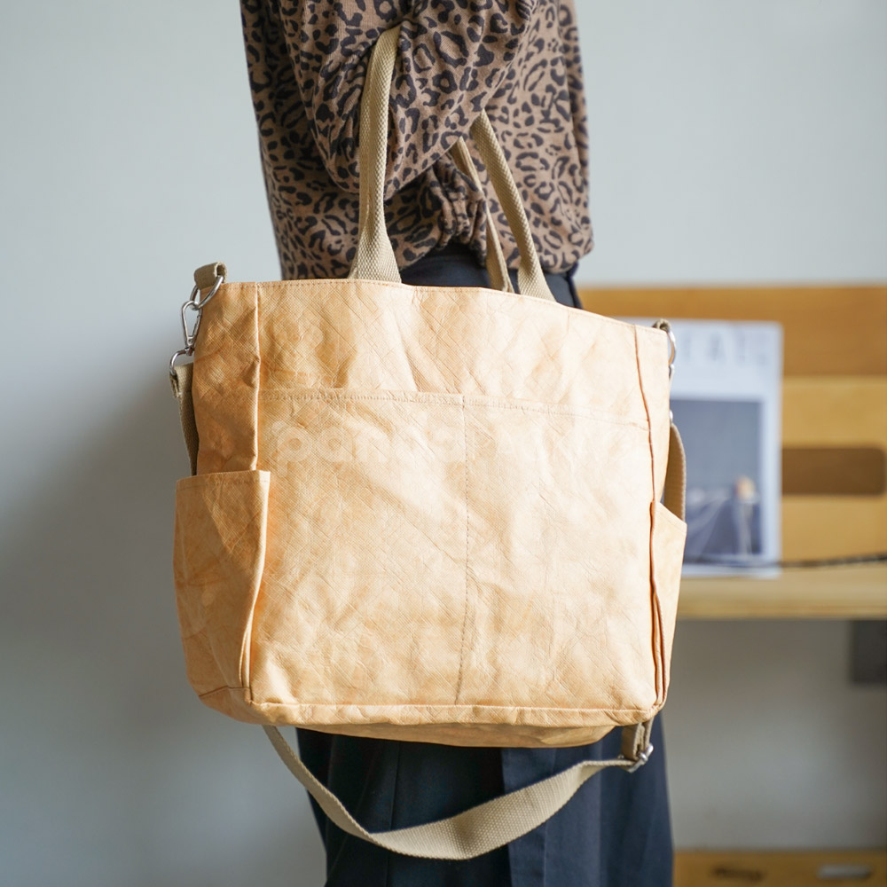 kraft paper tote bag with shoulder strap and side pockets