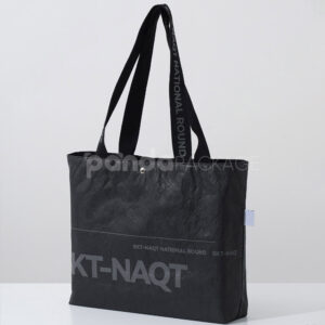 branded black paper bag with long webbing handles
