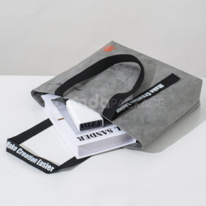 gray eco tote bag with brand logo and reinforced handles