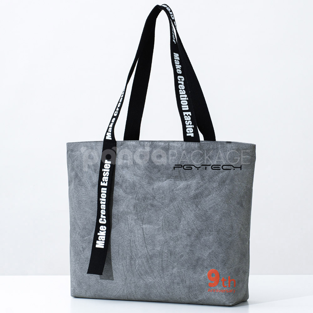 gray eco tote bag with brand logo and reinforced handles