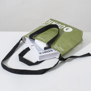 Olive green eco tote bag with black handles and branding