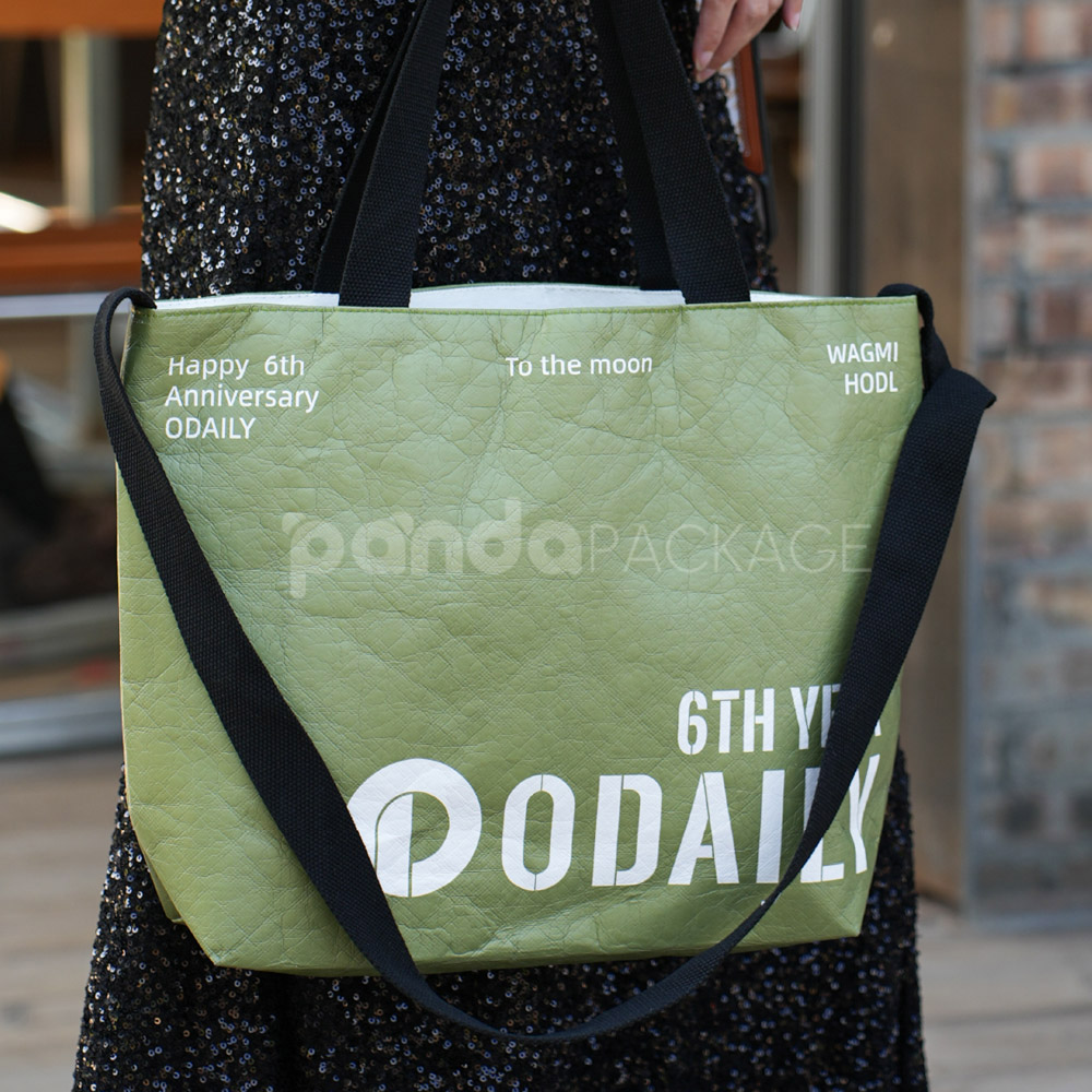 Olive green eco tote bag with black handles and branding