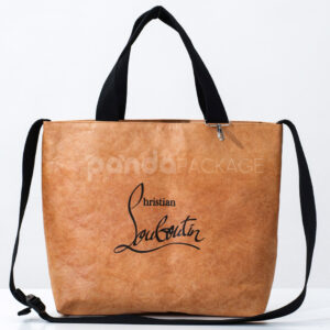 Brown kraft paper tote bag with black handles and shoulder strap